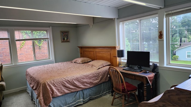 220 Belmont Rd Unit 3, Tallahassee, FL 32301 - bedroom featuring multiple windows, carpet flooring, a desk, and beam ceiling