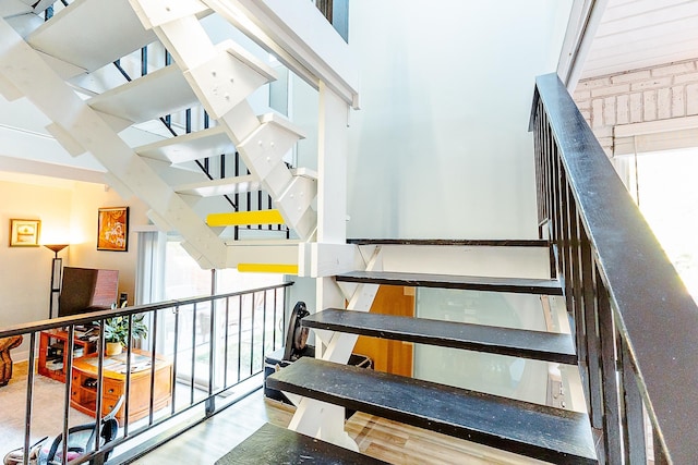 220 Belmont Rd Unit 3, Tallahassee, FL 32301 - stairway with wood finished floors and a towering ceiling