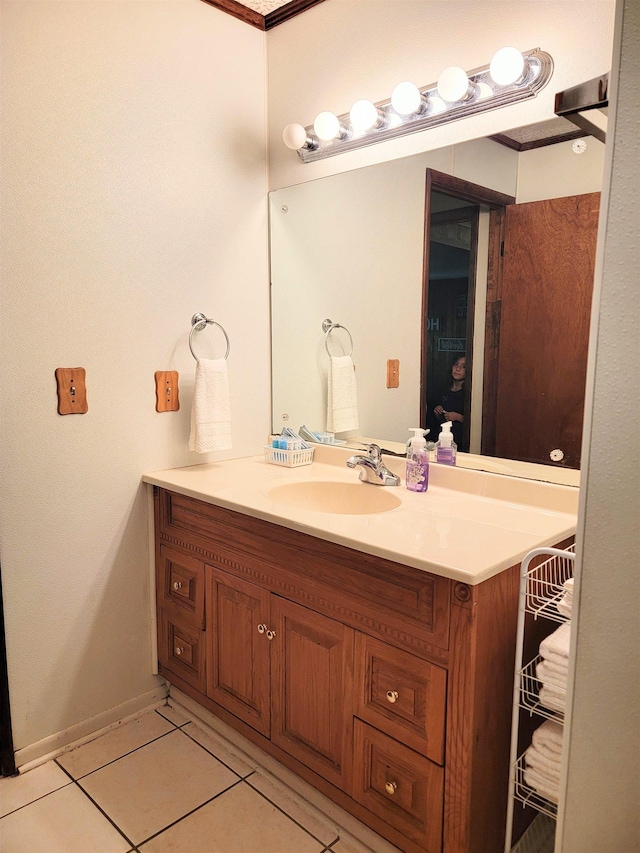 bathroom featuring tile patterned flooring and vanity