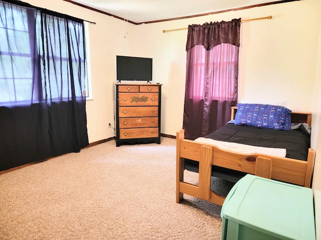 bedroom with crown molding and light carpet