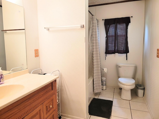 full bathroom featuring toilet, vanity, tile patterned floors, and shower / bath combo with shower curtain