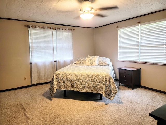 bedroom featuring carpet floors, ceiling fan, and ornamental molding