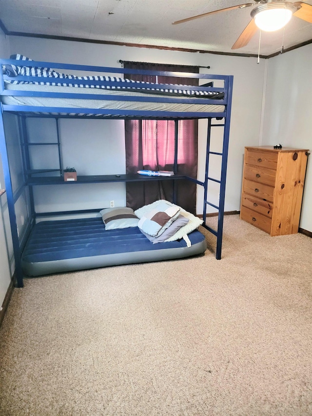 unfurnished bedroom featuring carpet floors and ceiling fan