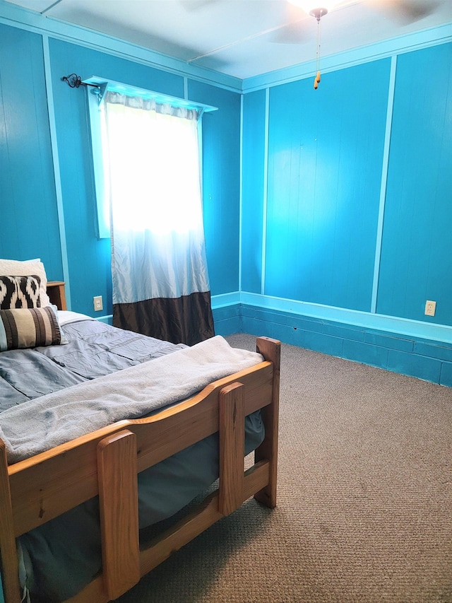 carpeted bedroom with crown molding