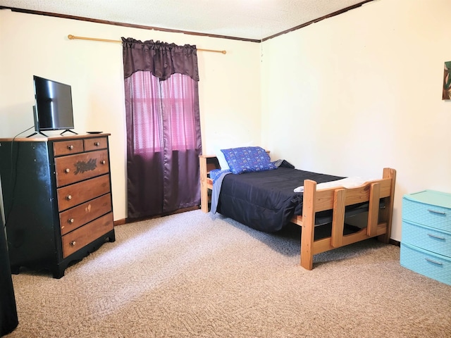 carpeted bedroom featuring crown molding