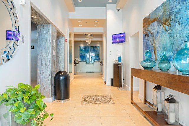 corridor with light tile patterned floors, baseboards, elevator, and recessed lighting