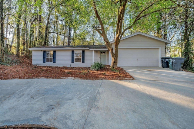 ranch-style home with an attached garage and driveway