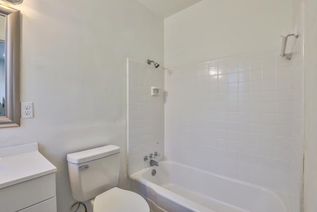 full bathroom featuring vanity, toilet, and tiled shower / bath