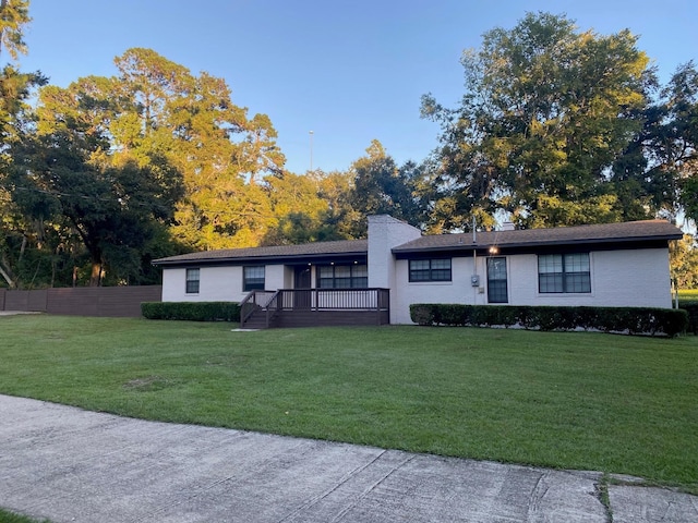 ranch-style house with a front lawn