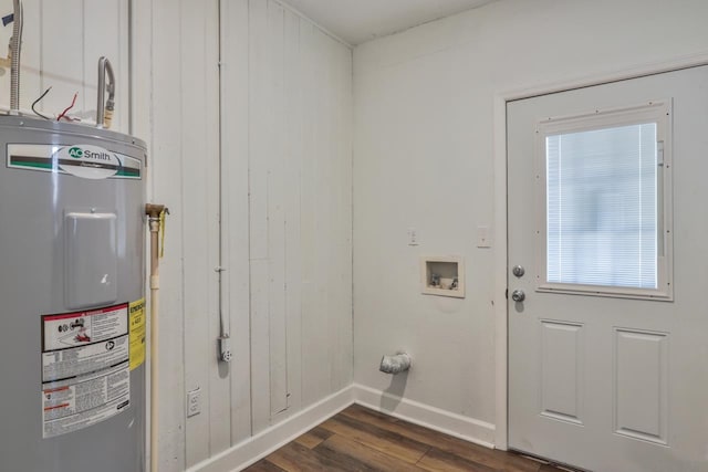 washroom with electric water heater, dark hardwood / wood-style flooring, and hookup for a washing machine