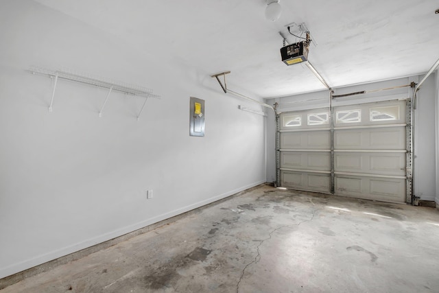 garage featuring electric panel and a garage door opener