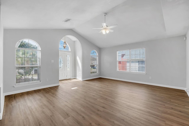 interior space with lofted ceiling, ceiling fan, and hardwood / wood-style floors