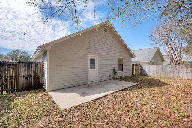 rear view of property featuring a patio area