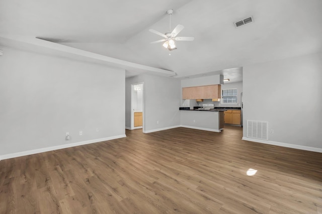 unfurnished living room with light wood-type flooring, lofted ceiling, and ceiling fan