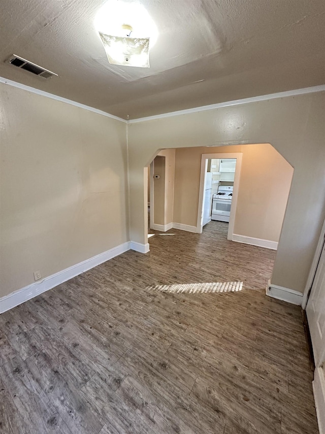 empty room featuring hardwood / wood-style floors and a textured ceiling