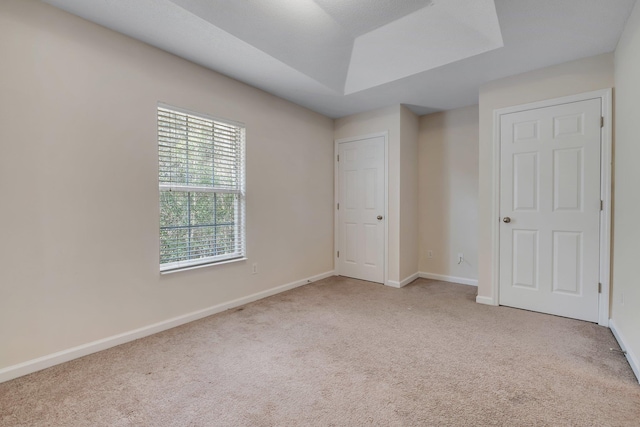 unfurnished bedroom with light carpet