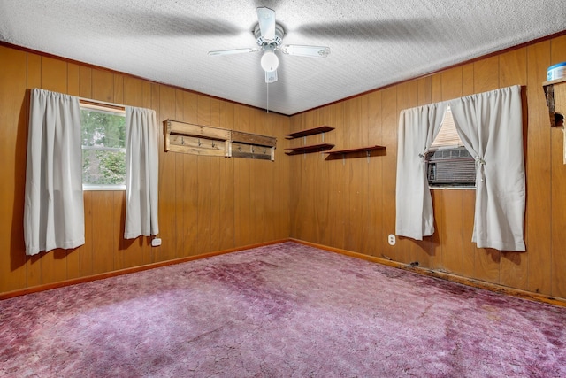 6206 Blountstown Hwy, Tallahassee, FL 32310 - unfurnished room with ceiling fan, wood walls, carpet floors, cooling unit, and a textured ceiling
