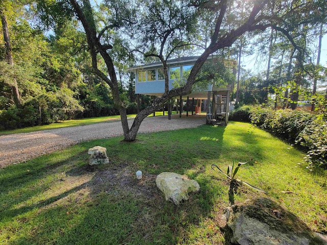 view of yard with a sunroom