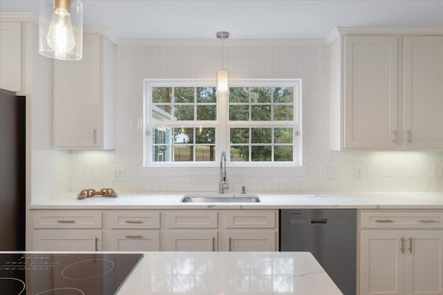 kitchen with sink, backsplash, black appliances, white cabinets, and decorative light fixtures