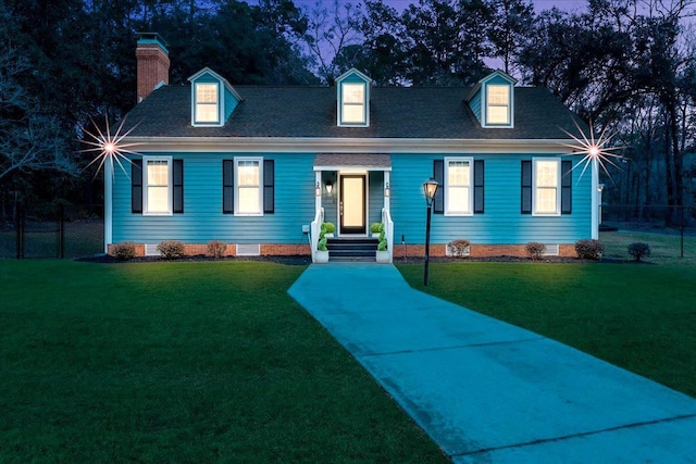 cape cod house with a front yard