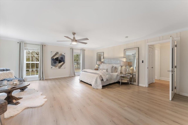 bedroom with crown molding, ceiling fan, and light hardwood / wood-style floors