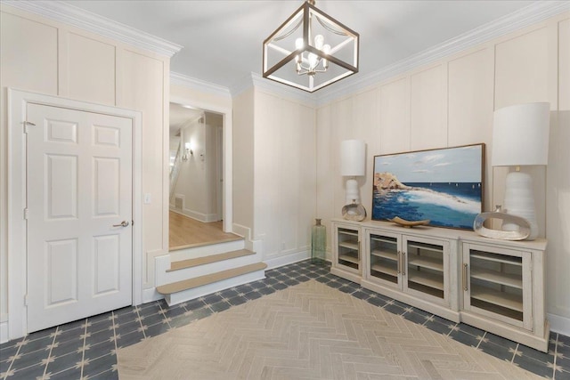 interior space featuring ornamental molding and a chandelier