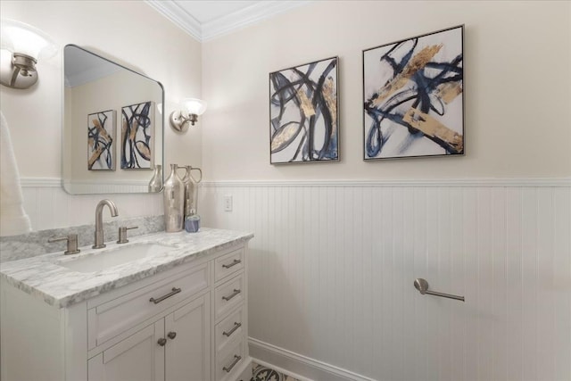 bathroom featuring crown molding and vanity