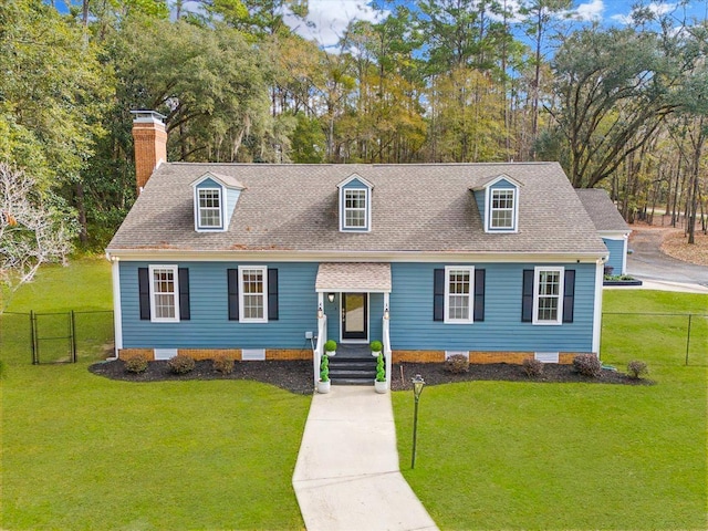 cape cod-style house with a front yard