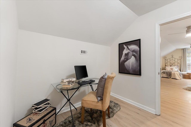 office space with lofted ceiling and light hardwood / wood-style floors