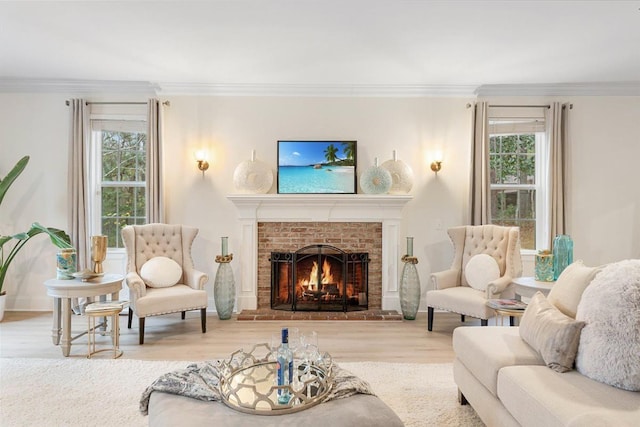 living room with hardwood / wood-style flooring, ornamental molding, and a fireplace