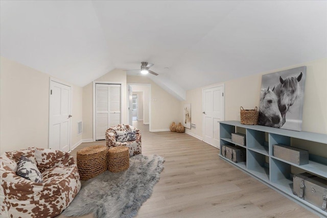 interior space with vaulted ceiling and light hardwood / wood-style floors