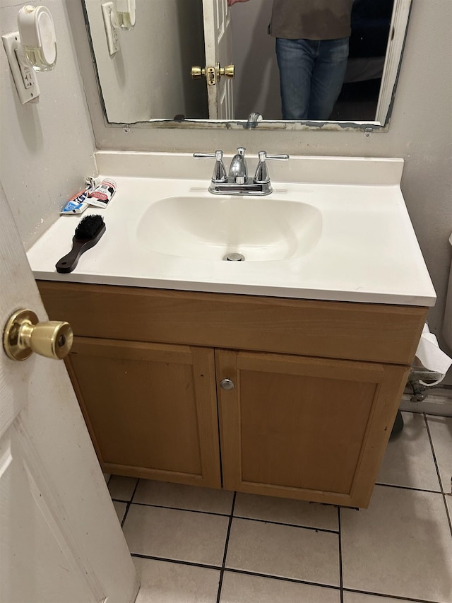 4750 Hibiscus Ave, Tallahassee, FL 32305 - bathroom featuring tile patterned floors and vanity