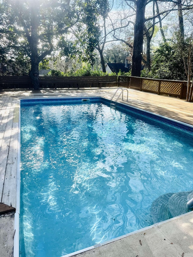 view of pool featuring a wooden deck and a fenced in pool