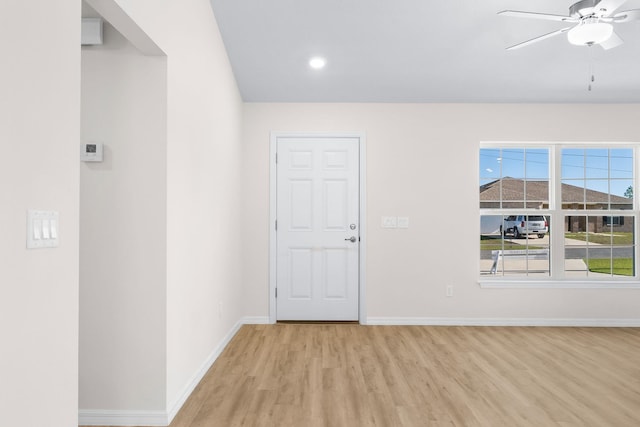 foyer featuring ceiling fan and light wood-type flooring