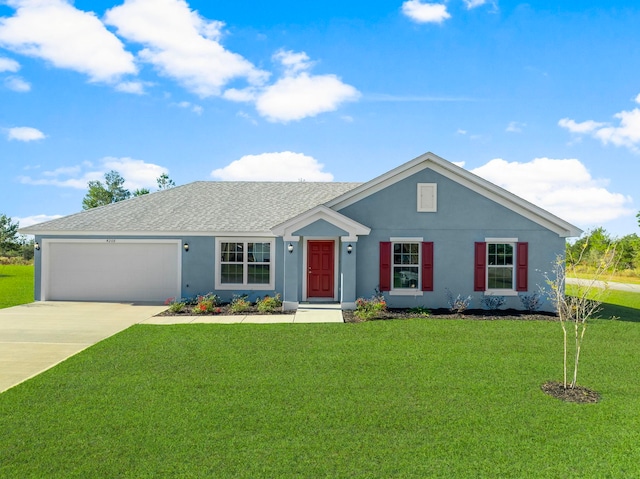 ranch-style house with a garage and a front lawn