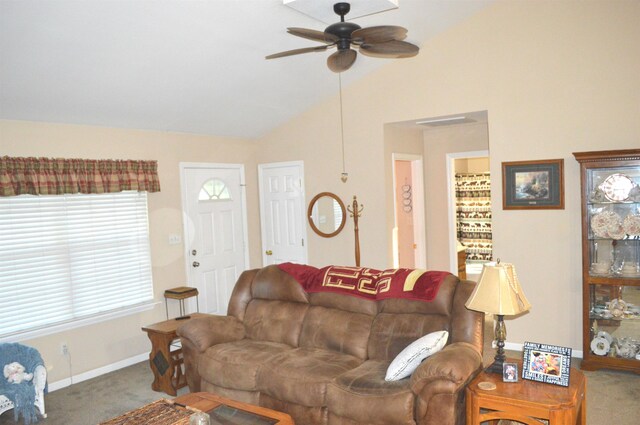 living room with ceiling fan, vaulted ceiling, and carpet