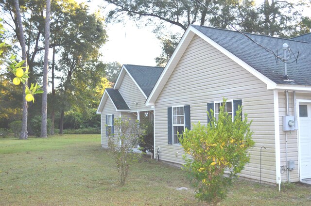 view of home's exterior featuring a yard