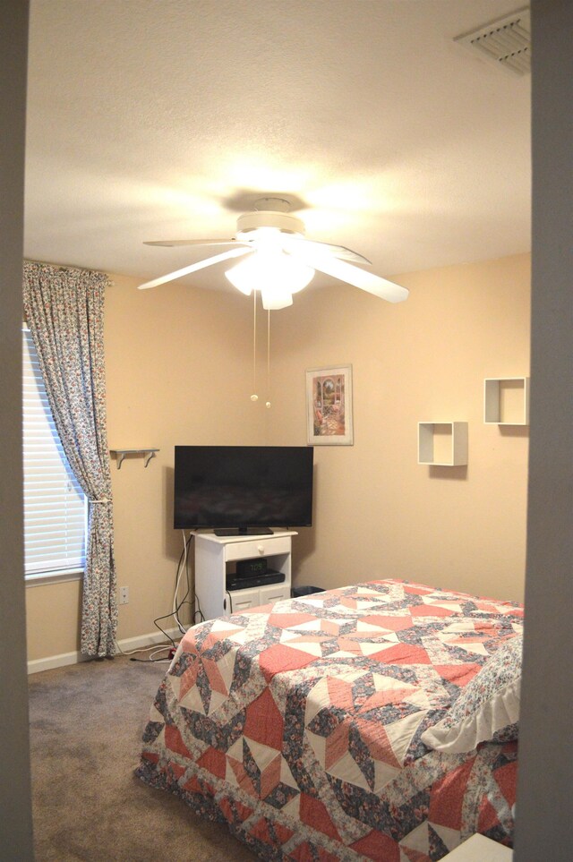 bedroom featuring carpet floors and ceiling fan