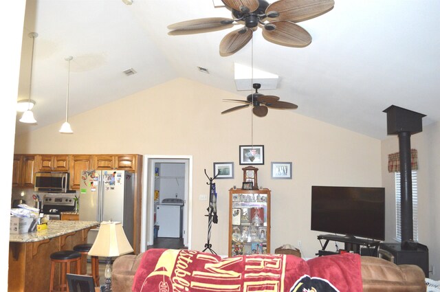 living room featuring lofted ceiling and ceiling fan