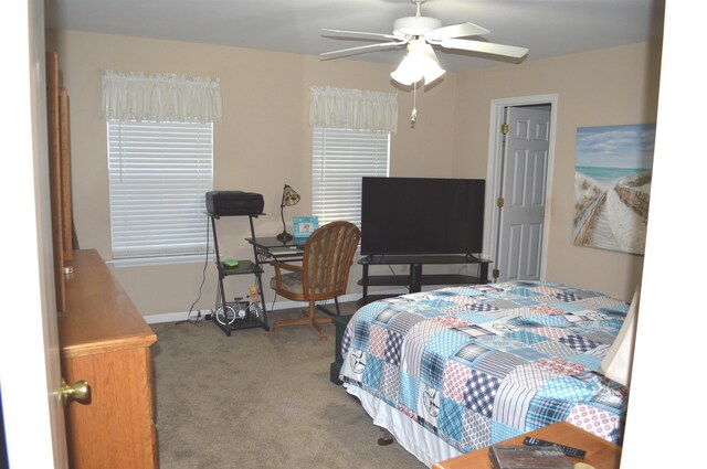 carpeted bedroom featuring ceiling fan