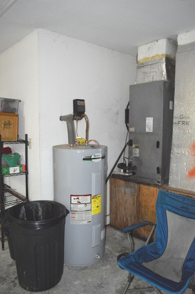 utility room with water heater and heating unit