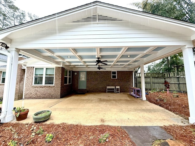 view of patio / terrace featuring ceiling fan and fence