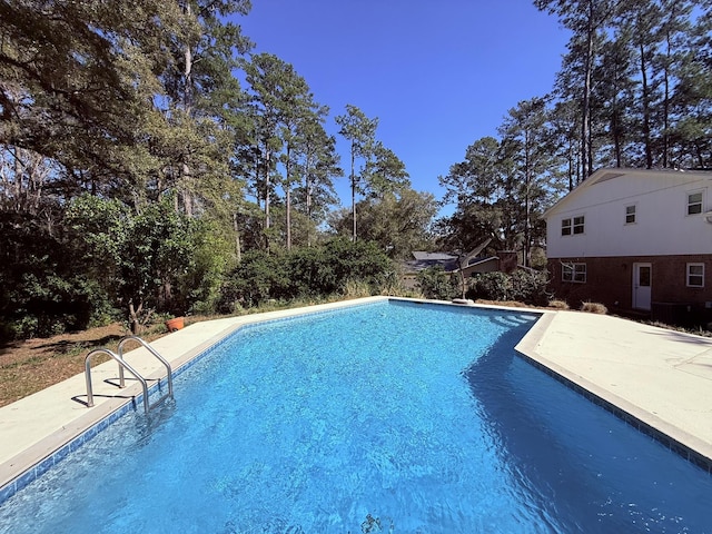 outdoor pool featuring a patio area