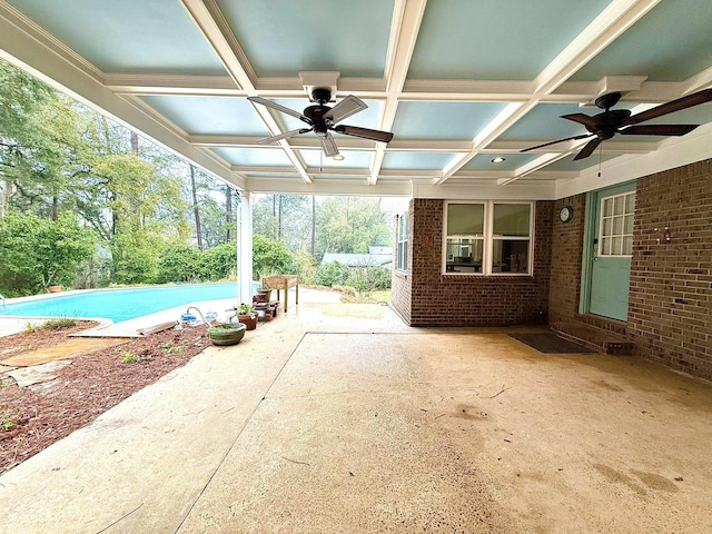 view of patio / terrace with an outdoor pool and a ceiling fan