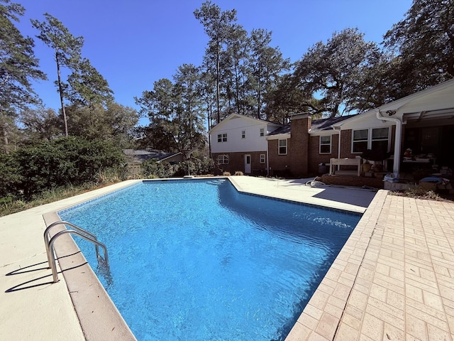 outdoor pool with a patio