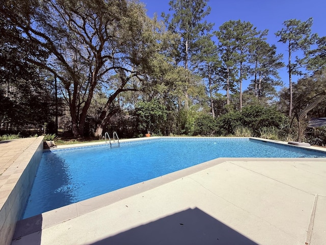 outdoor pool with a patio