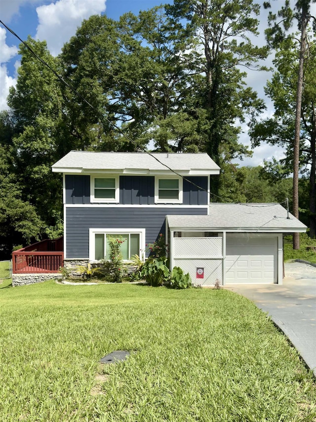 2408 Ionic Ct, Tallahassee, FL 32303 - view of front of house featuring board and batten siding, concrete driveway, a front yard, and an attached garage