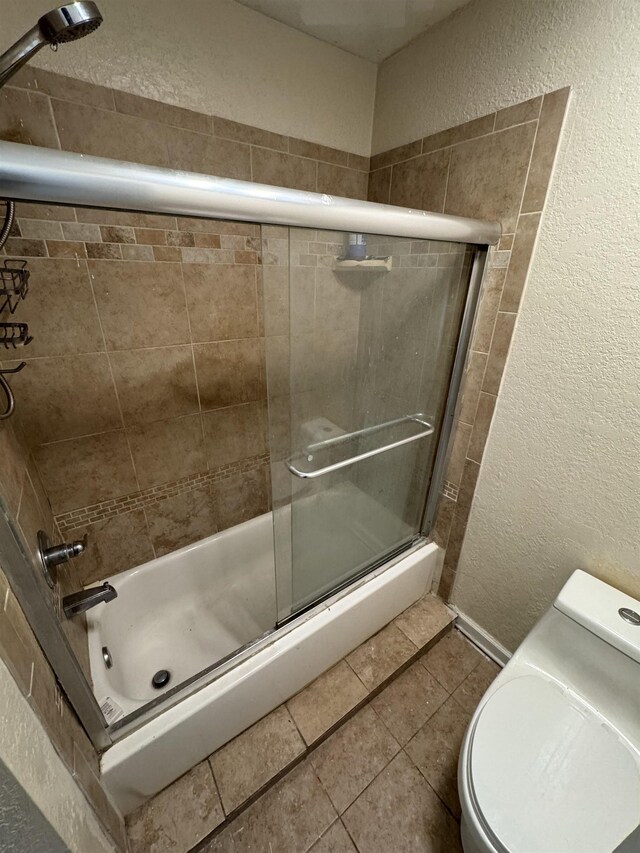2408 Ionic Ct, Tallahassee, FL 32303 - full bath with a textured wall, combined bath / shower with glass door, and tile patterned floors