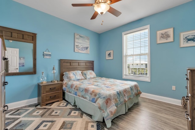 bedroom featuring light hardwood / wood-style floors and ceiling fan