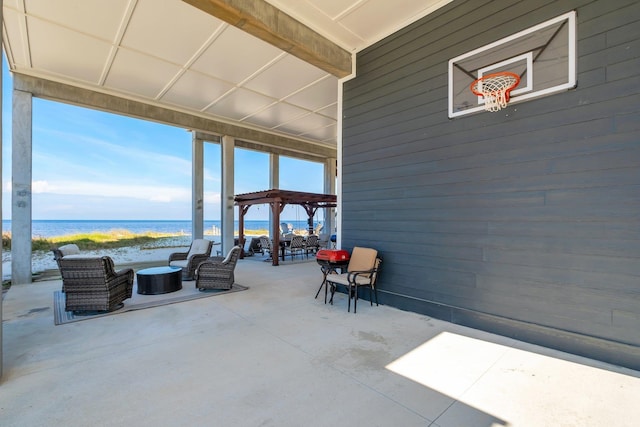 view of patio featuring a water view